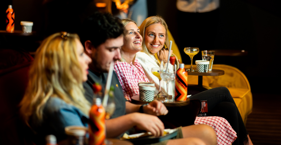 People enjoying drinks and food together at Everyman Cinema in Plymouth.